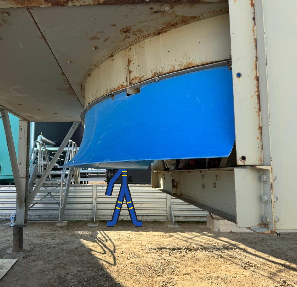 Fiberglass inlet bell bolted to the fan ring of an older air cooler at a gas processing site